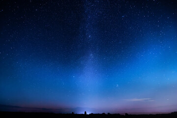 Blue starry sky. Night colorful landscape. Sky with many stars at night.