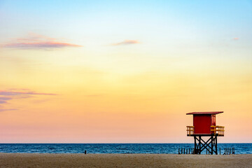 Rescue cabin on Copacabana beach at a tropical sunset on Rio de Janeiro city, Brazil