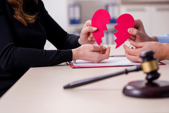 Young pair in courthouse in divorcing concept