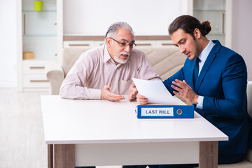 Young male lawyer visiting old man in testament concept - obrazy, fototapety, plakaty