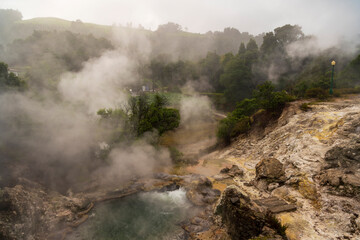 Fototapeta na wymiar Hot thermal springs in Furnas village, Sao Miguel island, Azores, Portugal. Caldeira do Asmodeu.