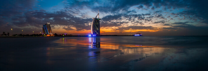 Burj al arab and jumeirah hotel during sunset