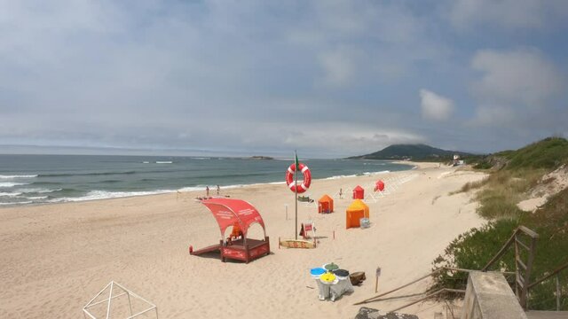 Moledo / Caminha / Portugal - July 8, 2020: The Praia de Moledo Beach. It's an Oceanic Beach in the northern hemisphere bathed by the Atlantic Ocean. Lifeguard lookout post, with big red lifebuoy.