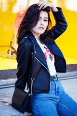 Obraz premium young pretty asian girl outside on big city street, lifestyle people concept