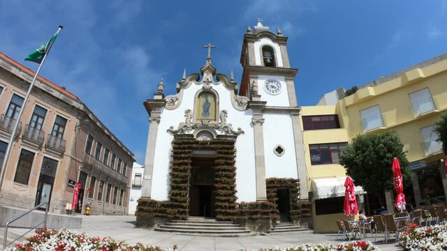 Vila Praia de Ancora / Caminha / Portugal - July 8, 2020: TILT Flowers decorating the outside of the grand old church Capela de Nossa Senhora da Bonan&ccedil;a, the chapel dedicated to Our Lady of Bonanca.
