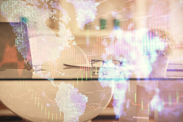 Double exposure of financial graph drawing and office interior background. Concept of stock market.