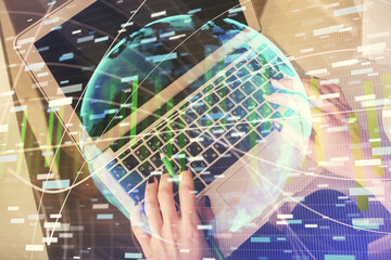 Double exposure of woman hands working on computer and financial theme hologram drawing. Top View. Business concept.