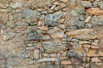 old rural house wall built by local stones