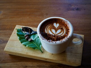 Cappuccino coffee in a white glass.