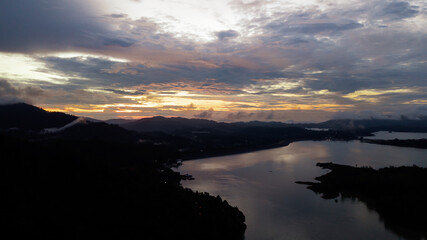 Aerial view of Kenyir Lake during blue hour sunrise.