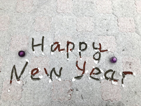 photo close-up of the inscription on the snow - Happy New Year