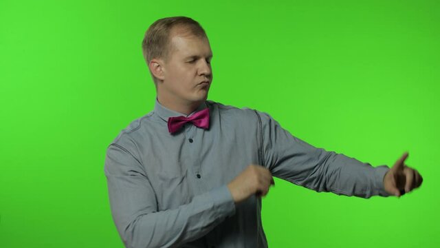 Handsome man moving in dance, smiling carefree, trends, gesture of success, celebrate. Chroma key