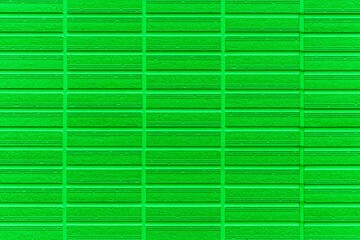 Modern green stone wall with stripes texture and seamless background