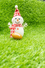Golfer Christmas Holiday with Snowman with golf ball on green grass
