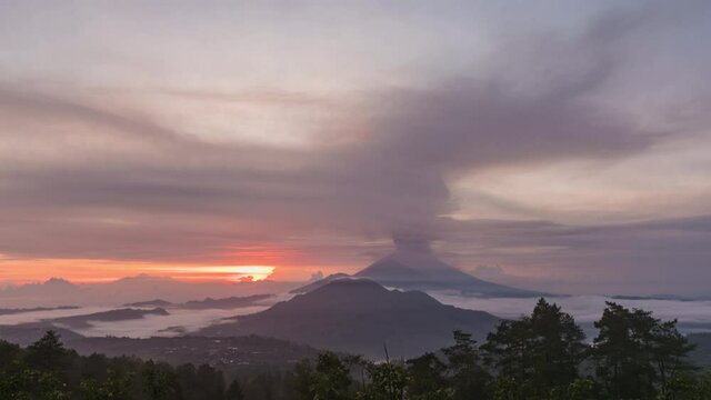 Timelapse of the eruption volcano Agung in Bali with beautiful views of the nature and volcano Batur and Abang. Big smoke and ash cover the sky. sunrise time in kintamani. unesco