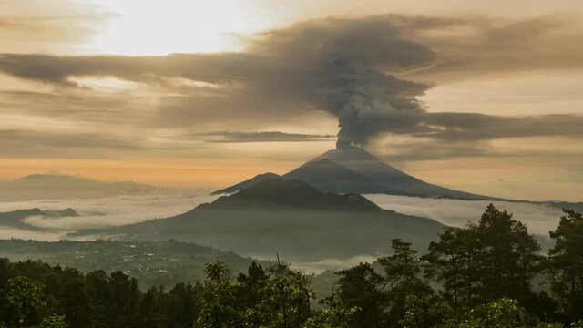 Timelapse of the eruption volcano Agung in Bali with beautiful views of the nature and volcano Batur and Abang. Big smoke and ash cover the sky. sunrise time in kintamani. unesco