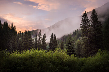 Cloudy Colorado mountain scenery during sunset. 