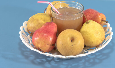 Several species and varieties of pear fruits on blue background
