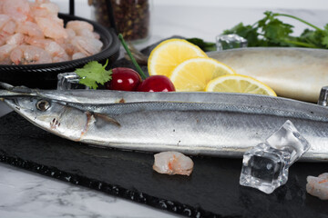 Fresh catch of fish and other seafood isolated on white background