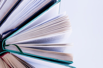 Hard cover books in row on white background,close up taken