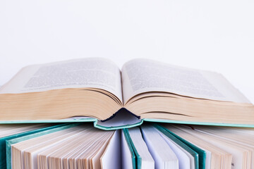 Fototapeta premium Hard cover books in row on white background,close up taken