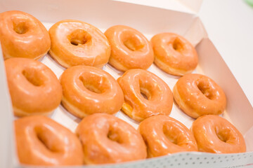 Bakery fresh soft and sweet delicious glazed donuts in box