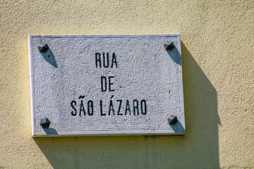 View of a street or road name an identifying name given to a street, usually forms part of the address to further help identify them in the streets of Lisbon 
