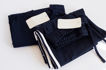 Unused,new striped navy color,sportswear folded on white with blank label.