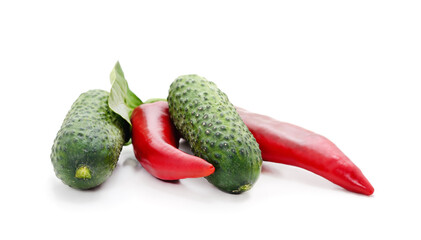 Two ripe cucumbers and red pepper.