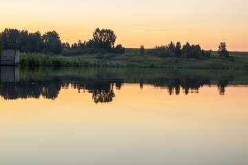 Fototapeta na wymiar Beautiful and colorful sunset on a lake in Siberia, Russia