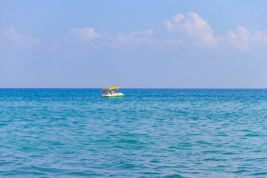 Young Couple On A Pedalo Boat In The Black Sea, Ukraine