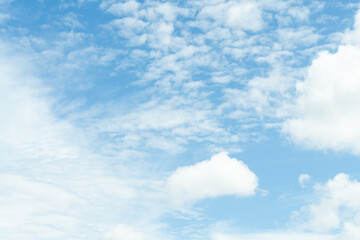 Naklejka na ściany i meble white soft cloud texture on blue sky backdrop