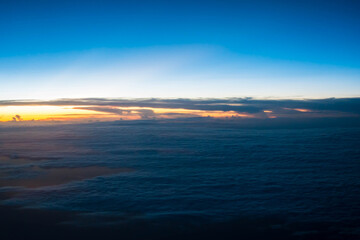 Sunset with blue sky view from airplane window