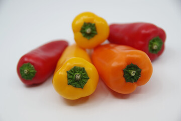 Small sweet peppers isolated on a white background.
