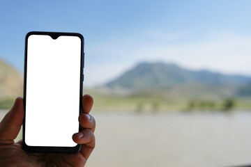 person using mobile phone outdoors