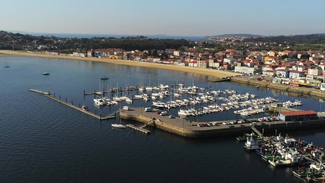 Boats in the marina. Coastal village of Galicia,Spain. Aerial Drone Video