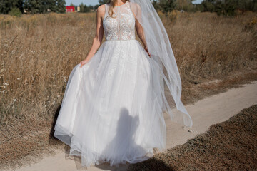 bride in a wedding dress in the field