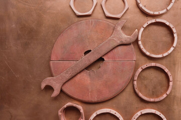 Copper set of tools and devices on a copper surface. Aircraft tools. Monochrome image. Copy space.