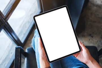 Top view mockup image of a woman holding black tablet pc with blank white desktop screen