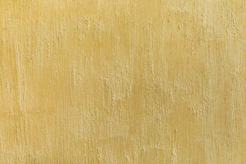 Decorative shabby plaster wall in beige color. Concrete scratched texture empty background.