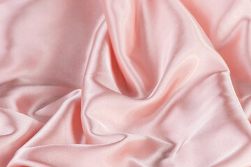 Close up. Pink silk wrinkle fabric texture.