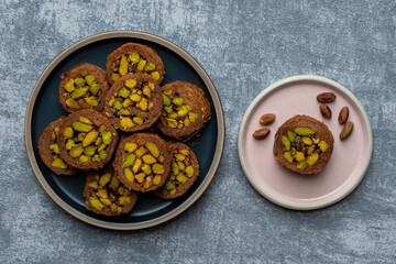 Arabic dessert or Sweets MABROUME with Pistachios.top view