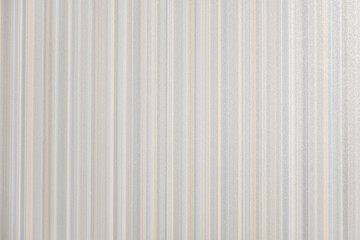 Furniture surface with vertical stripes in pastel colours, closeup view. Grey, blue, pink tender pastel colours.