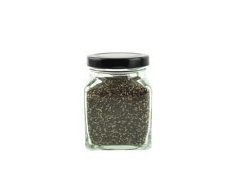 Organic Chia Seeds in a glass bottle with black lid isolated on a white background. Superfood, high Omega 3 and high Protein. Healthy concept...