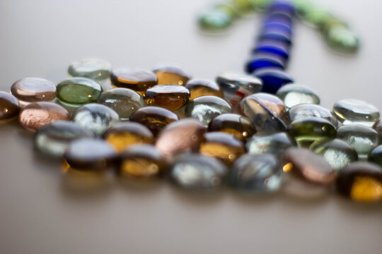 Transparent colored stones on white background