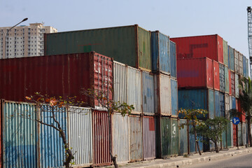 heaps of colorful containers in the harbor area