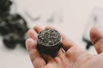 Close up of marijuana blunt with grinder. marijuana Rolling a marijuana joint. cannabis joint.