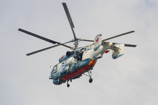 SAINT-PETERSBURG, RUSSIA - JULY 28, 2019: The helicopter Ka-27PS (RF-19159) of the Russian Navy with television equipment videotaping