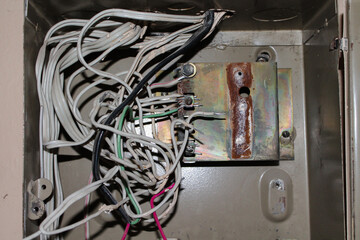 Abandoned electric brush. Fuse box in an abandoned building without fuses, only with wires. Wires...