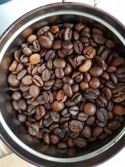 Fototapeta premium Coffee beans lie in a can